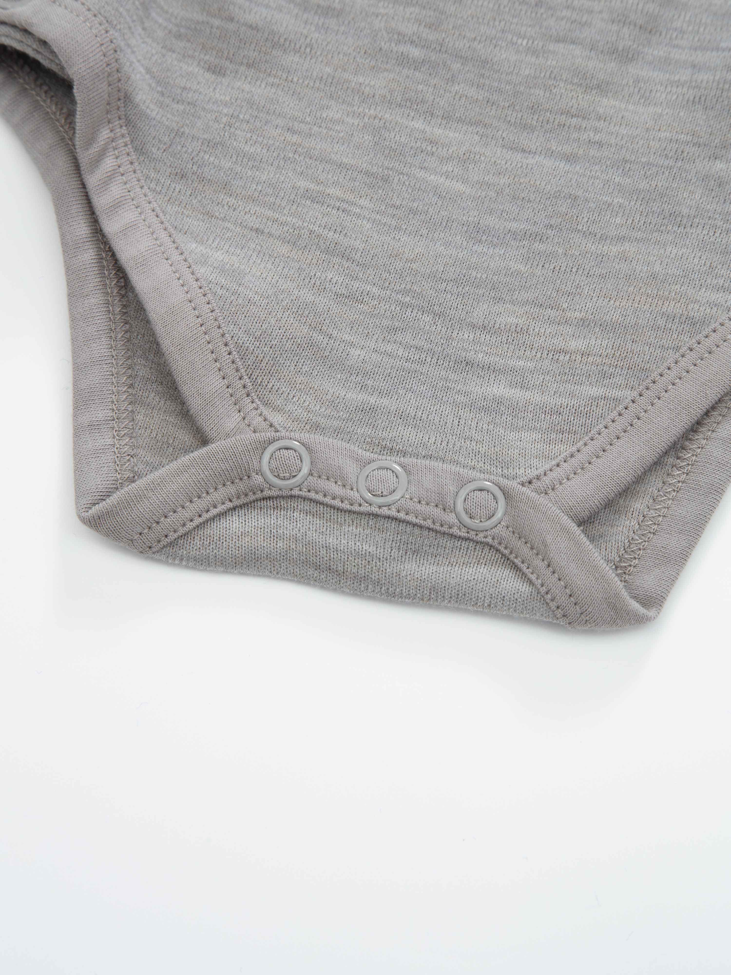 Bergen Omslagsbody 0-6 md Sand Melange