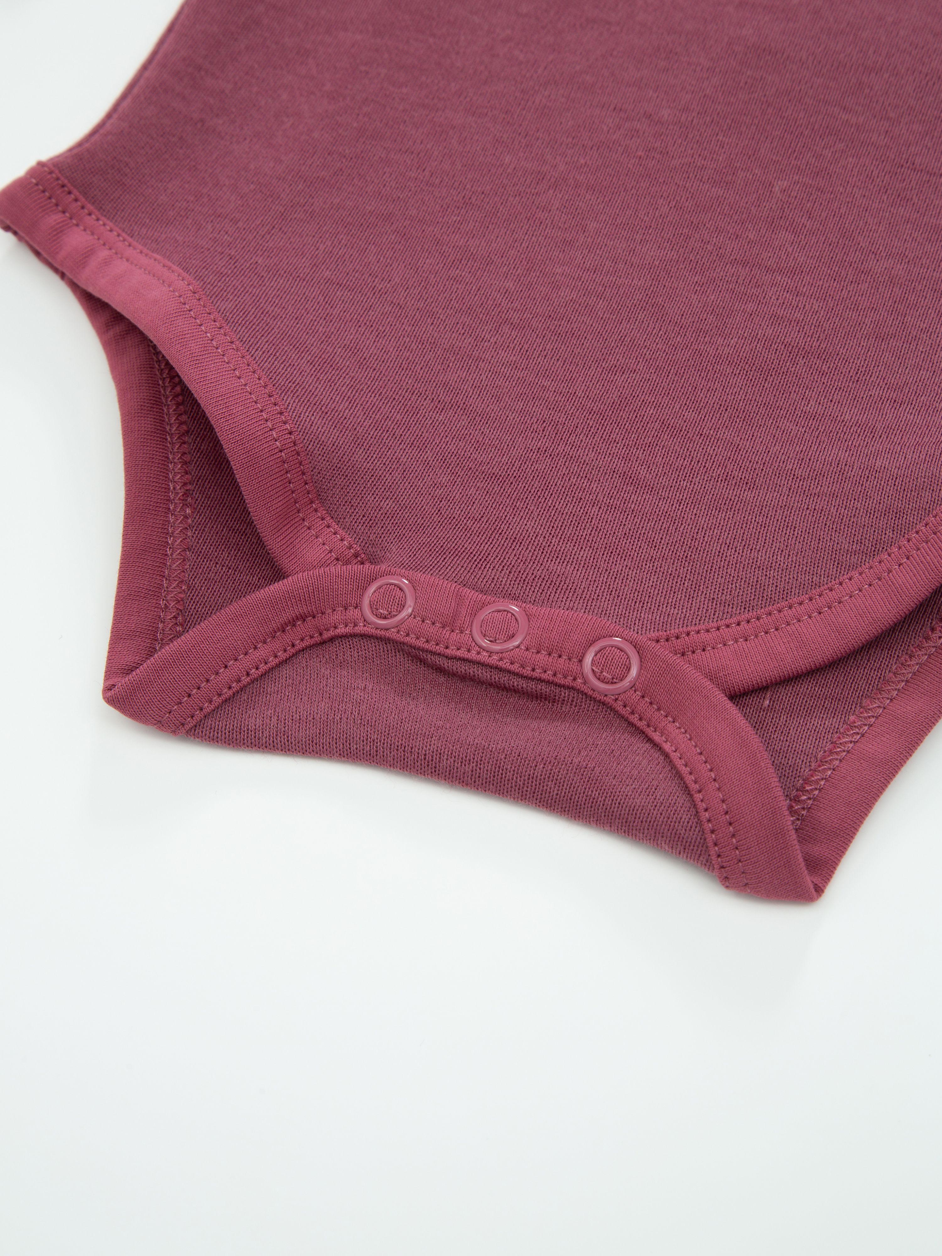 Dovre Merino Ullbody 0-3 år Dark Blush